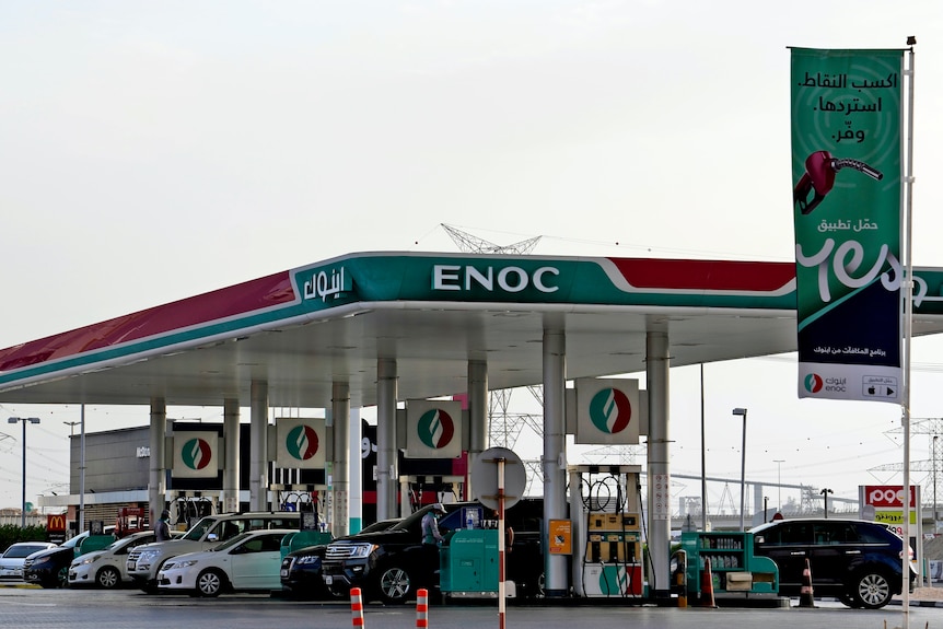 Cars fill up in Dubai at a petrol station