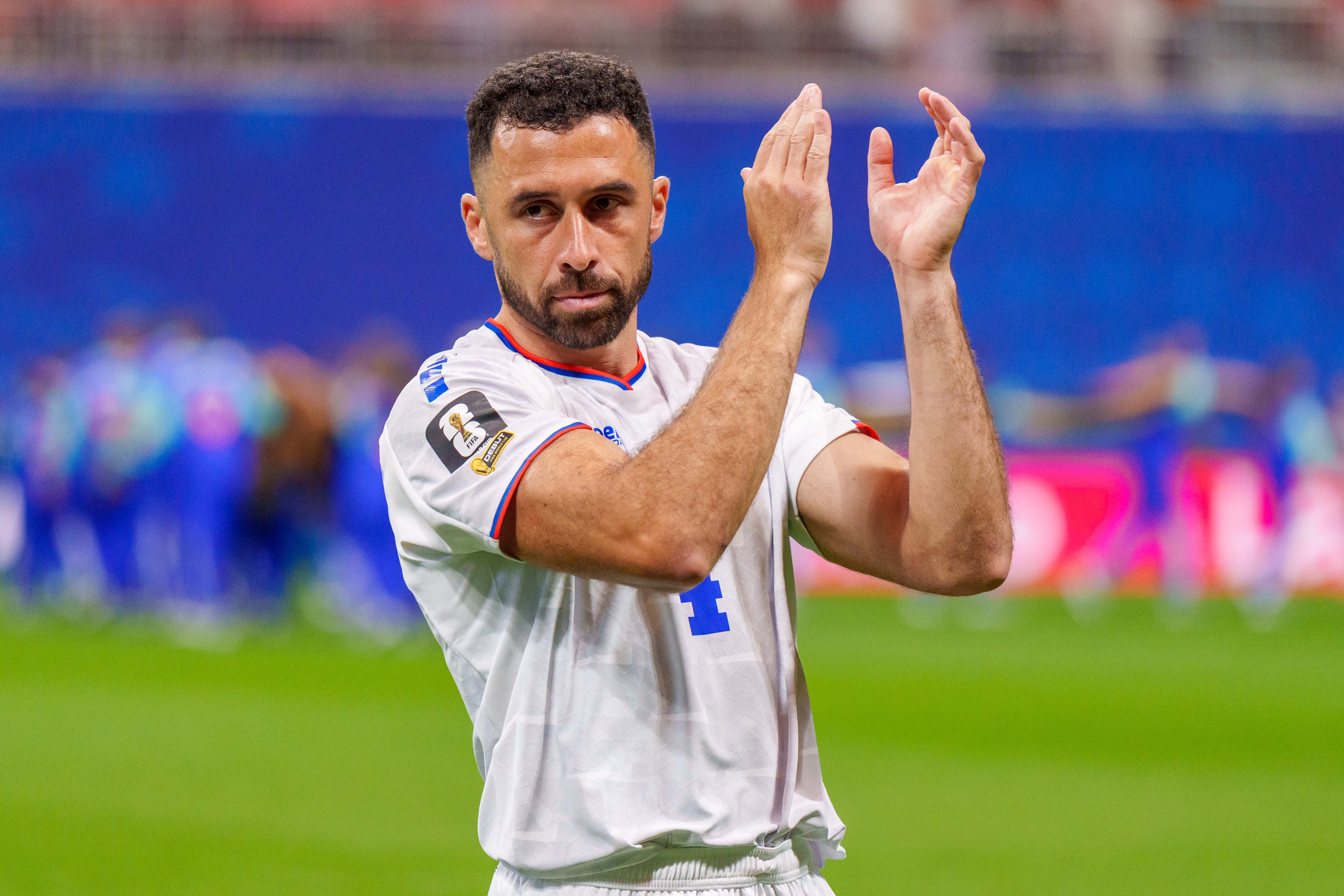 Roberto Lopes applauds the fans after a game