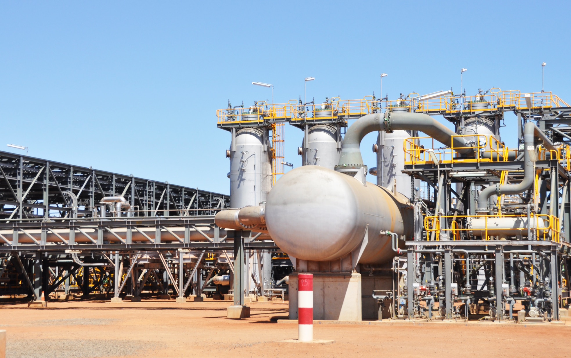 A large gas plant with lots of metal infrastructure. 