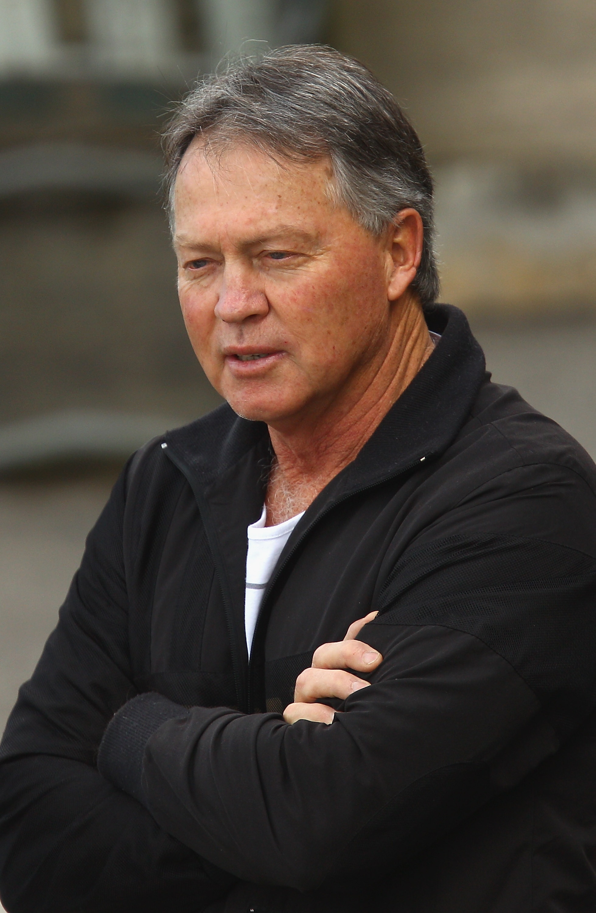Close-up of a man with short grey hair. 