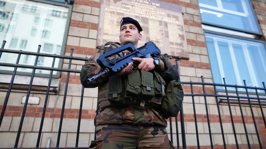 French soldier stands outside Jewish school in Paris