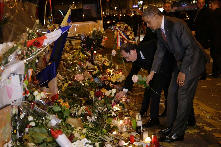 Barack Obama lays a wreath