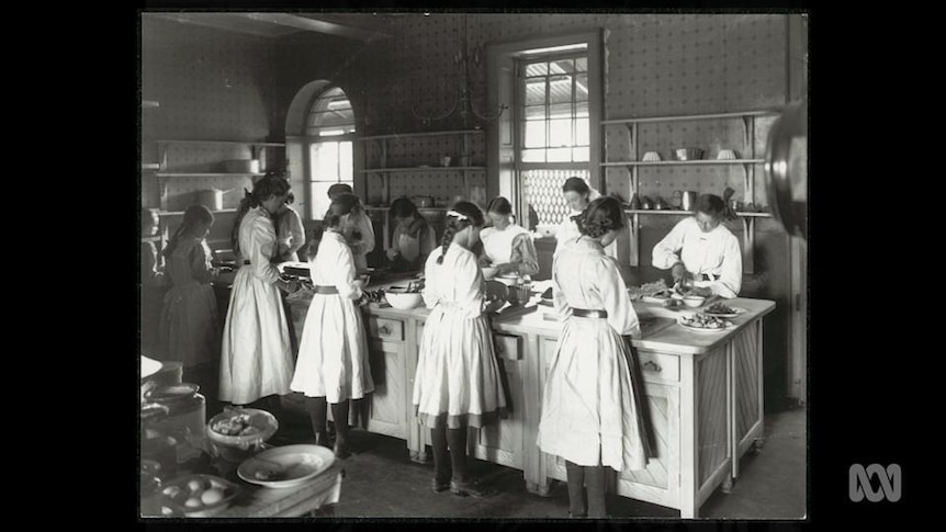 Old photo of schoolgirls in cookery class