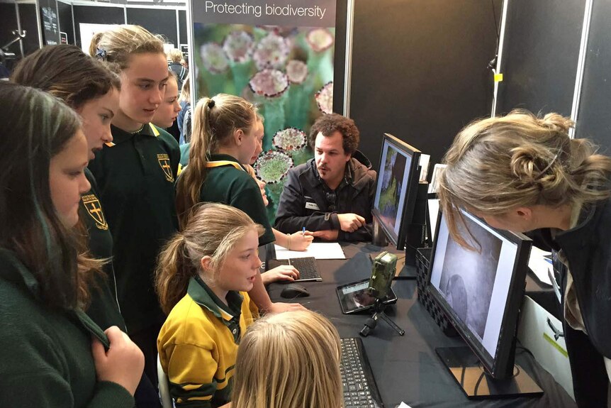 Primary school children hear from members of the Tasmanian Land Conservancy on the first day of the festival.