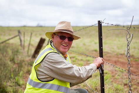 BlazeAid volunteer Dennis Bishop working on a fence.