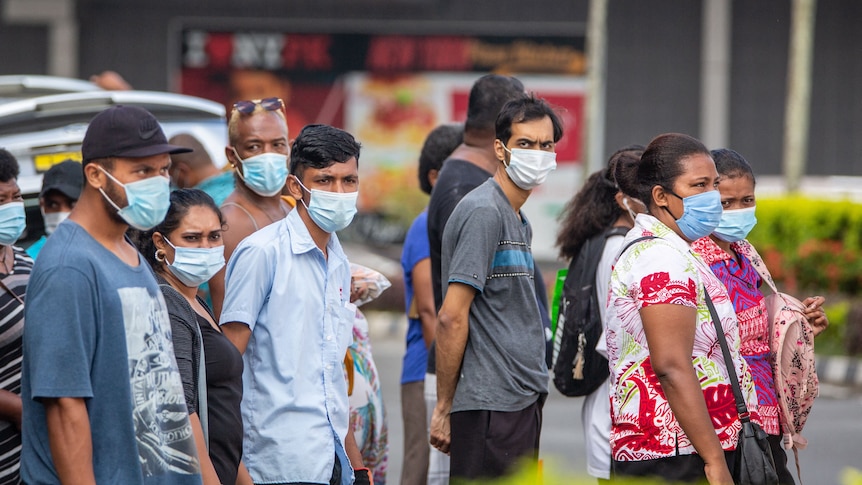 People in Fiji wear masks.