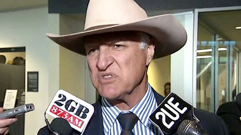 Bob Katter speaks to the media after arriving at Canberra Airport