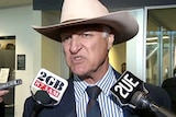 Bob Katter speaks to the media after arriving at Canberra Airport