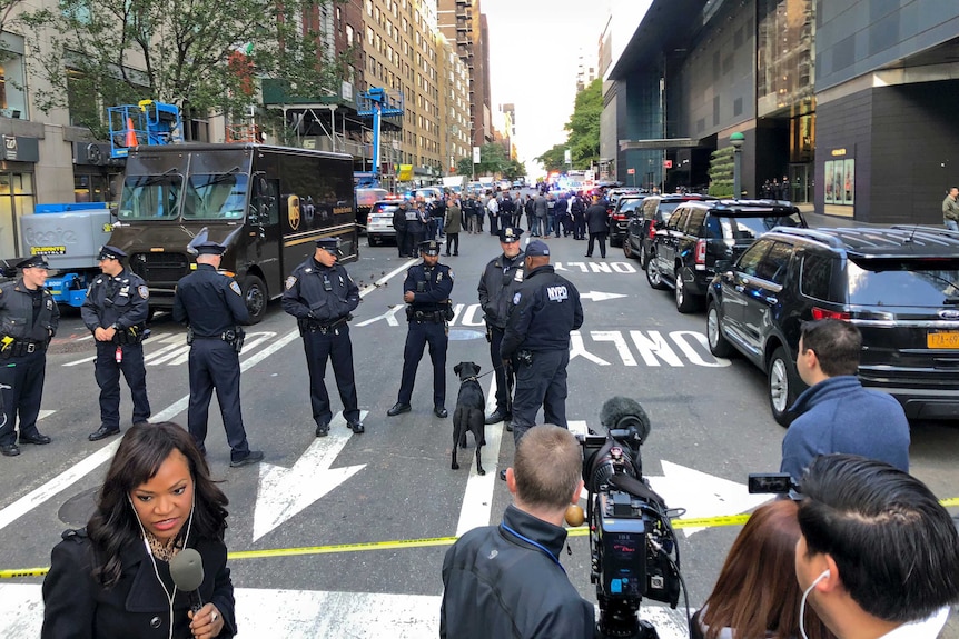 New York Police stand outside the Time Warner Centre at Columbus Circle.