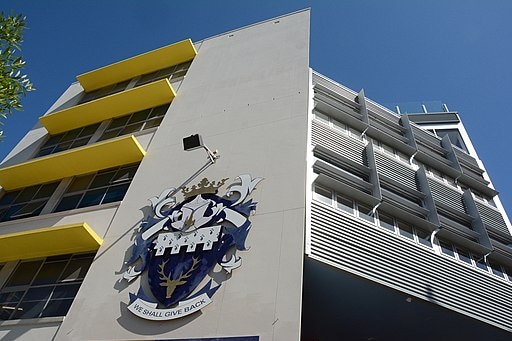 A school insignia on a building.