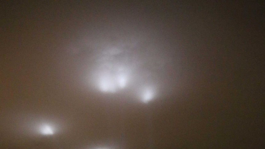 Lights from Articulated Intersect land on cloud cover above Hobart during Hobart's Dark Mofo festival