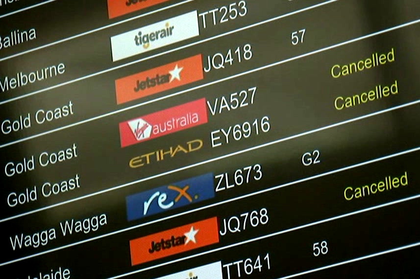 An airport  board showing several cancelled flights.