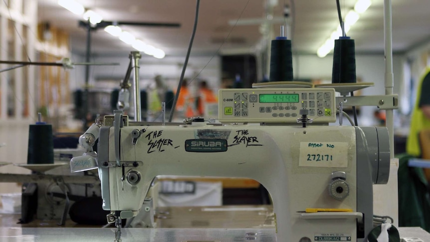 A sewing machine used by the inmates to make garments, with the words "the Slayer" written on it in texta.