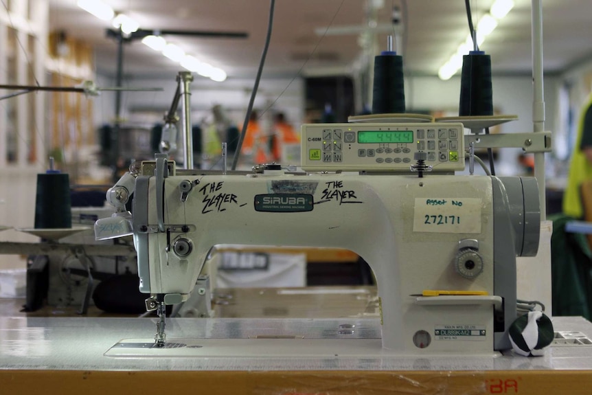 A sewing machine used by the inmates to make garments, with the words "the Slayer" written on it in texta.