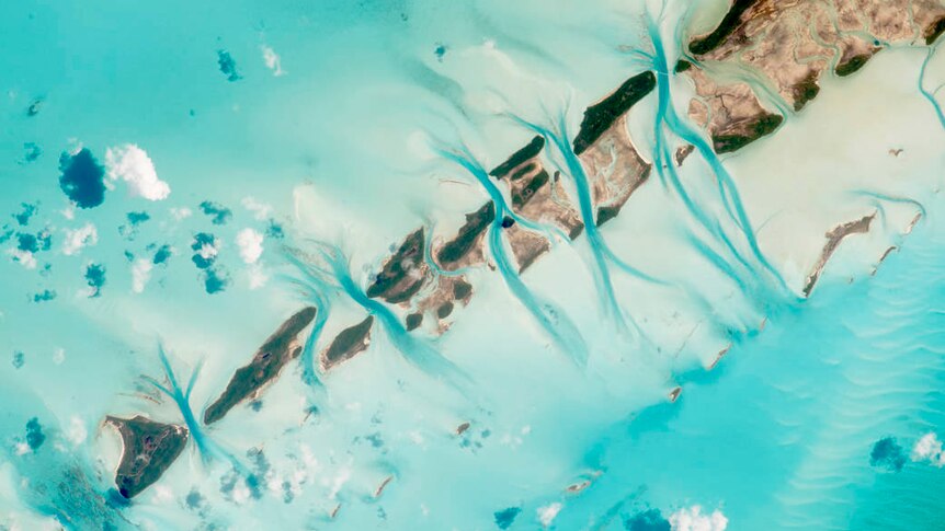 The Great Exuma Island chain in the Bahamas seen from the International Space Station which channels cut through them by tides