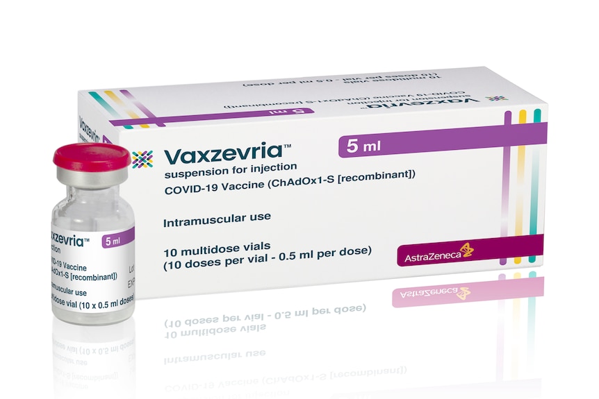 A vaccine vial next to a white box with the Vaxzevria label across it