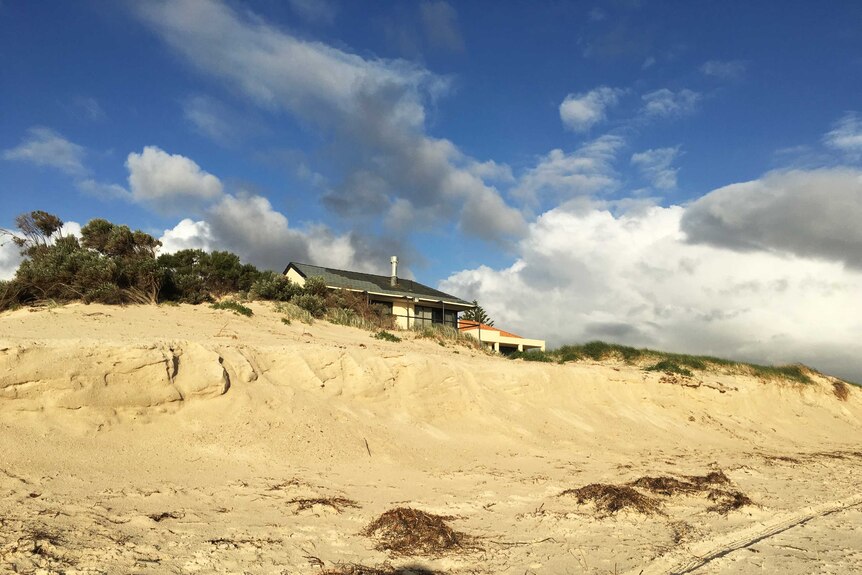 Some Adelaide coastal housing is very close to the sand at Tennyson