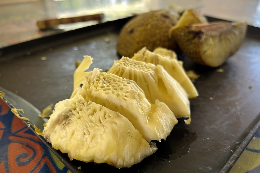 Breadfruit cut up sitting on platter. 