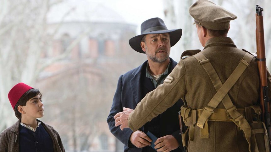 Russell Crowe plays a Victirna father, and confronts an army officer in Turkey as a local boy looks on.