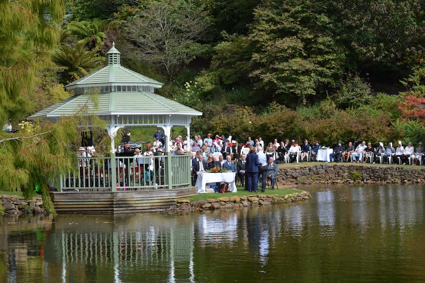 People gathering at Burnie's Emu Valley Rhododendron Gardens for the Ritual of Lament.