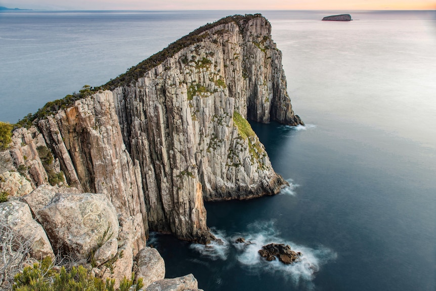 Dolerite columns rise from the sea off the Tasmanian coast