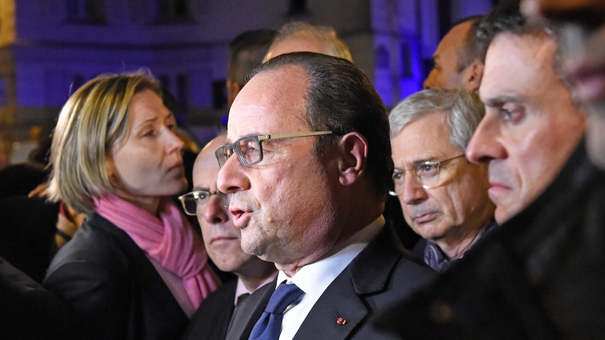 French President Francois Hollande addresses reporters near the Bataclan concert hall