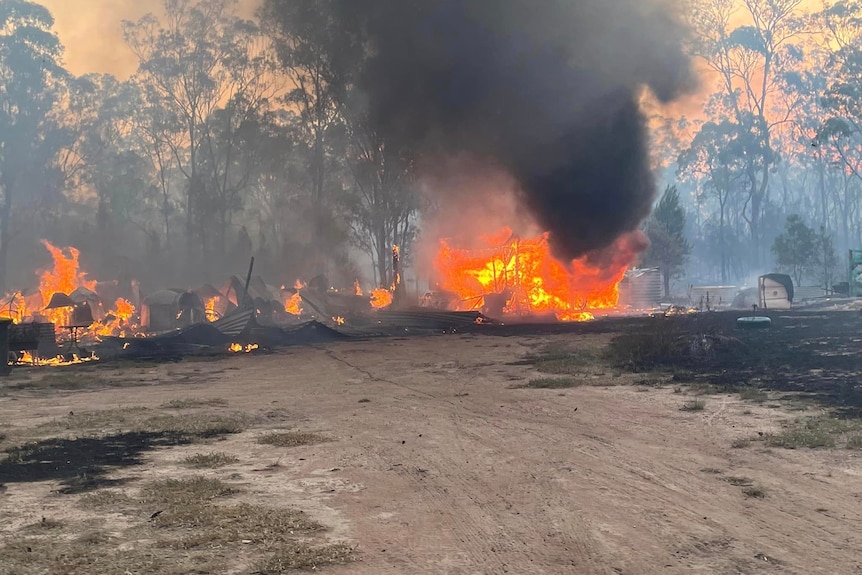 A fire still burning at a building. 