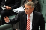 Acting prime minister Wayne Swan speaking during Question Time at Parliament House in Canberra.