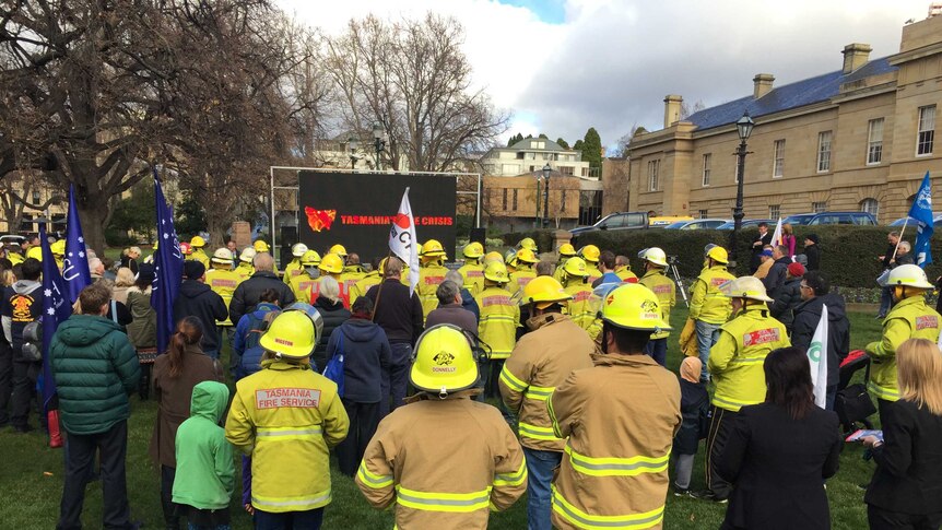 Firefighters rally at Parliament House in Hobart over funding.