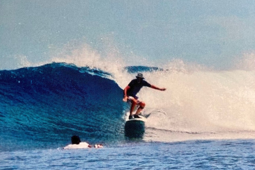 Colin Chandler surfing in the Maldives. Ausnew Home Care, NDIS registered provider, My Aged Care