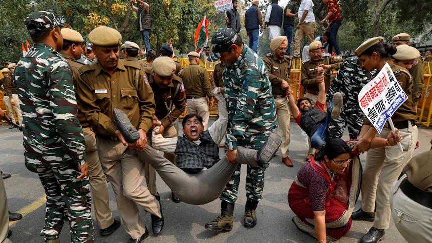 Police detain activists of the youth wing of India's main opposition Congress party.