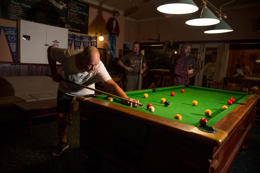 Footscray hotel resident Johnny plays pool