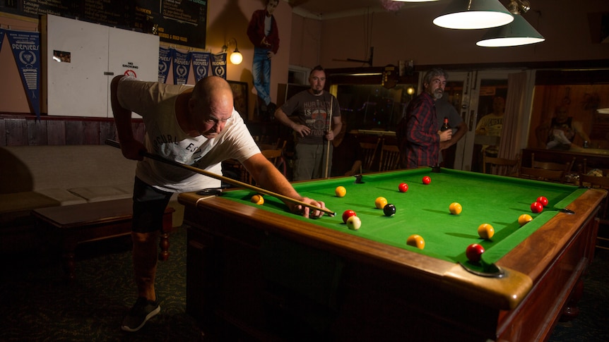 Footscray hotel resident Johnny plays pool