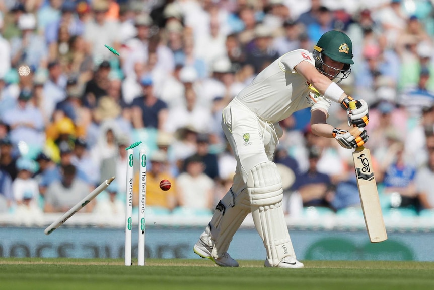 Australia batsman Marcus Harris plays a shot as his off stump is hit hard by the cricket ball.