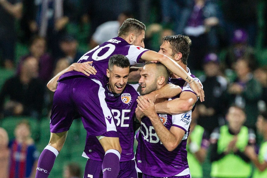 Perth Glory players celebrate a goal