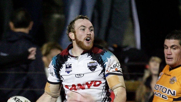 Luke Walsh celebrates his second try