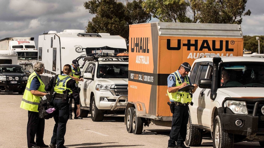 Police at a road block.