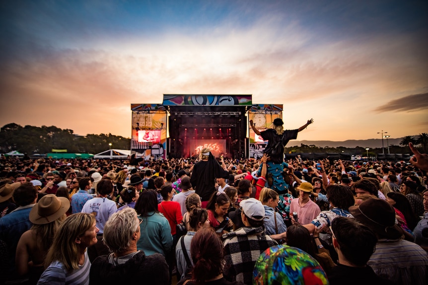 Image of crowd at music festival at sunset