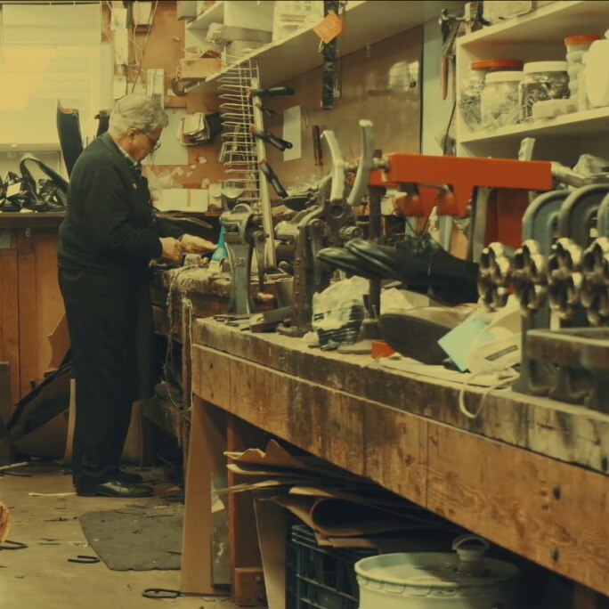 image of man recycling shoes in a workshop