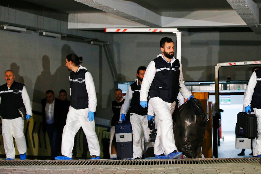 Crime scene investigators leave an underground car park, after looking for possible clues into the killing of Saudi journalist.