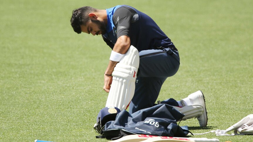 India's Virat Kohli pads up during a training session in Adelaide on November 29. 2014.
