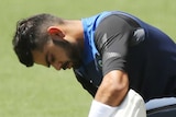 Kohli straps the pads on in training