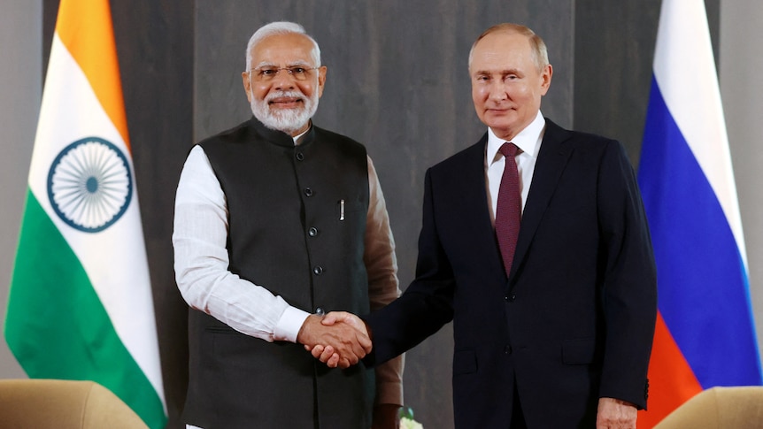 Indian Prime Minister Narendra Modi and Russian President Vladimir Putin shaking hands