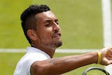 Nick Kyrgios gestures to the crowd during Wimbledon