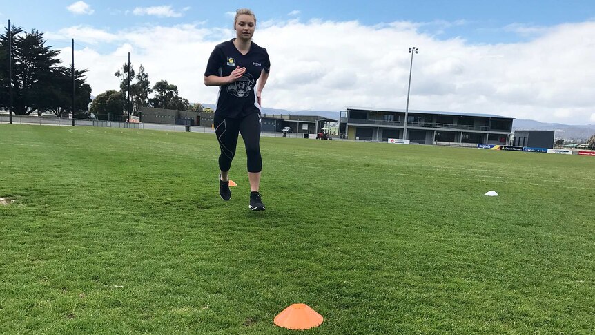 Daria Bannister training on a sports oval.