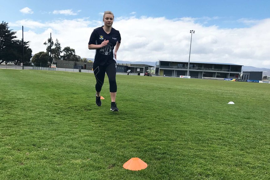 Daria Bannister training on a sports oval.
