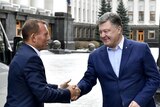 Tony Abbott shaking hands with Petro Poroshenko