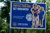 A sign reading 'protect your mob, get vaccinated'.