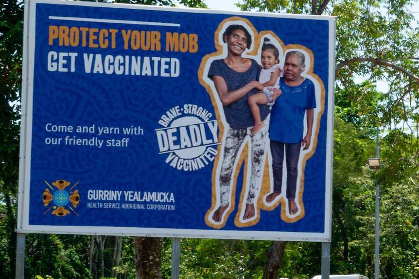 A sign reading 'protect your mob, get vaccinated'.