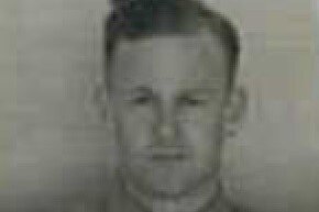 A blurred, grainy black-and-white headshot of a young WWII airman.